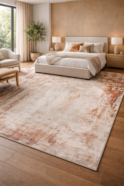 Neatly arranged bedroom with a large rug, bed, and decor.